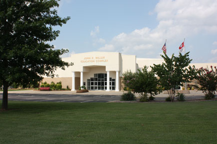 Image of The John E. Miller Complex is the largest building at the Melbourne campus and is located at the north end. It was constructed in 1997, and an addition was added on the north side in 1999. The building hosts most Humanities courses, as well as the Physical Fitness center, the Student Success center, the TRiO program, and the Culinary Arts restaurant and laboratory, and an open computer lab. One of the classrooms is a compressed video classroom connecting to the Mountain View and Ash Flat sites. This building features an 18,500 square-foot auditorium.